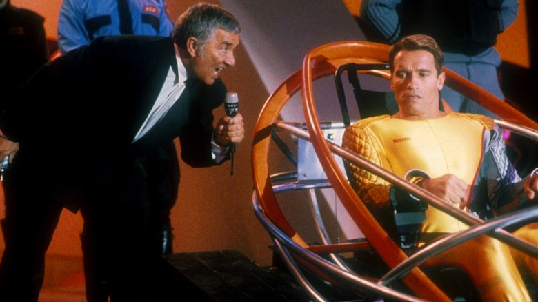 "The Running Man" host Killian (Richard Dawson) won't let Richards (Arnold Schwarzenegger) get the last one-liner in.