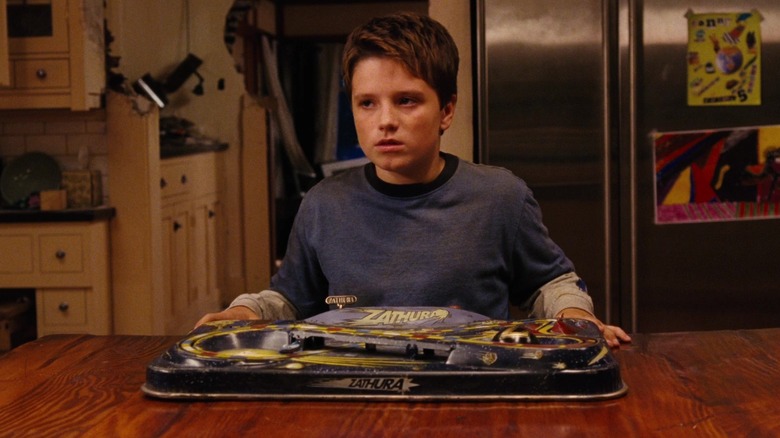 Josh Hutcherson as Walter holding the board game in "Zathura: A Space Adventure"