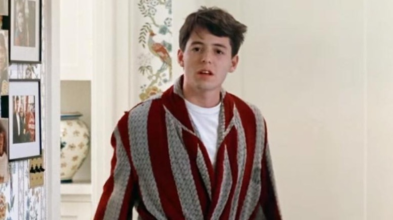 Matthew Broderick as Ferris Bueller wearing a bathrobe in Ferris Bueller's Day Off.