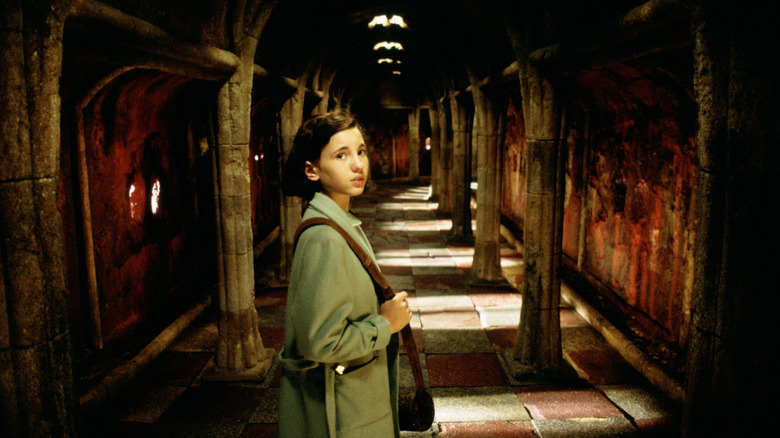 Ivana Baquero looking concerned as Ofelia in Pan's Labyrinth.