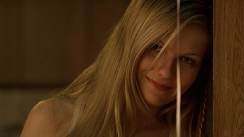 Kirsten Dunst as Lux smiling in The Virgin Suicides.