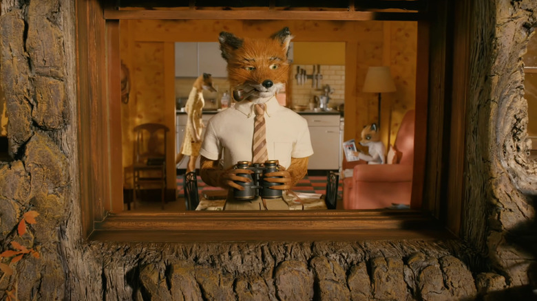 George Clooney as Mr. Fox peers out a window in Fantastic Mr. Fox