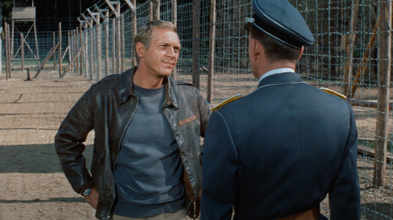 Steve McQueen as Captain Virgil Hilts confronts a soldier in The Great Escape