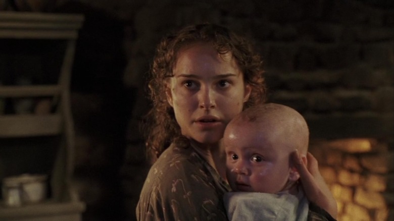 Natalie Portman holds baby