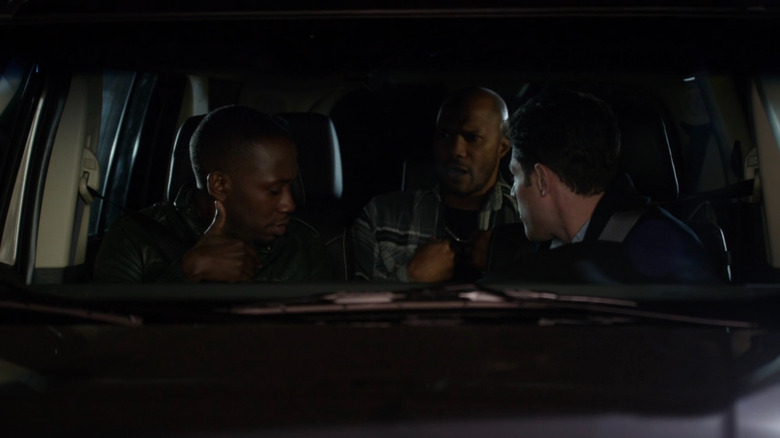 Schmidt and Winston in a car with Robert on New Girl