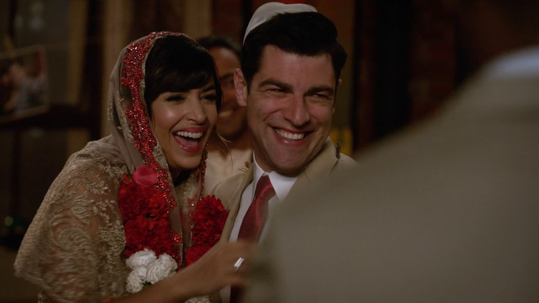 Schmidt and Cece smiling as they get married on New Girl