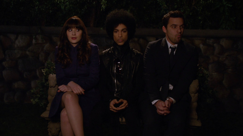 Nick and Jess sitting with Prince on New Girl