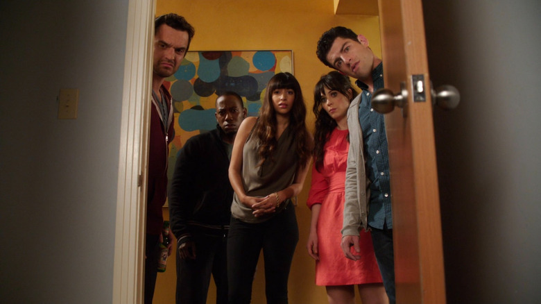 Nick, Winston, Cece, Jess, and Schmidt looking through a doorway on New Girl