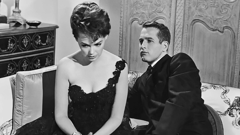 Paul Newman looks angrily at Barbara Rush