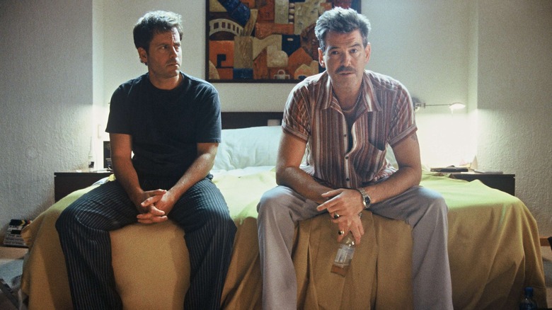 Pierce Brosnan and Greg Kinnear sit bed The Matador