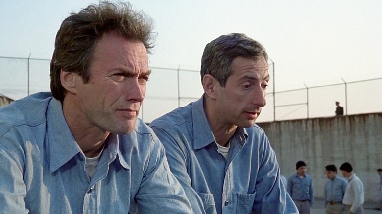 Clint Eastwood as Frank and Larry Hankins as Charley sitting together in Escape from Alcatraz