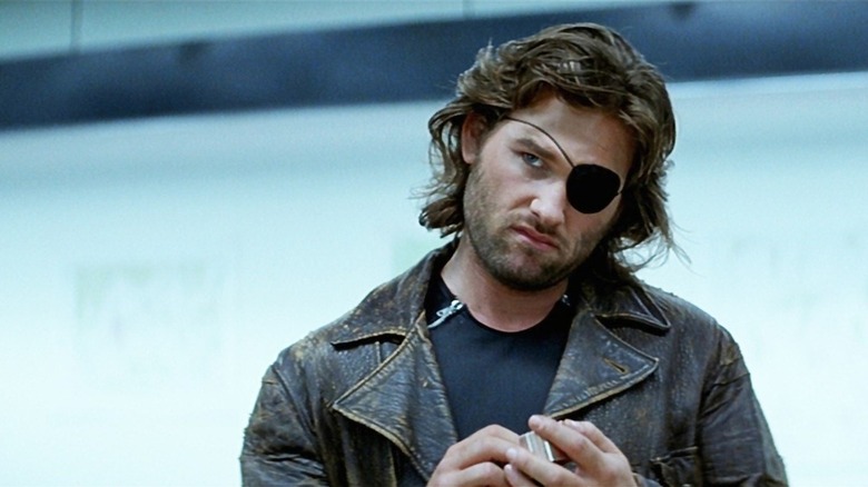 Kurt Russell as Snake Plissken looking unconvinced in Escape from New York