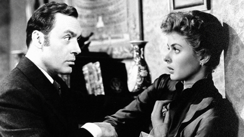 Gregory (Charles Boyer) grabbing Paula's (Ingrid Bergman) arm in Gaslight