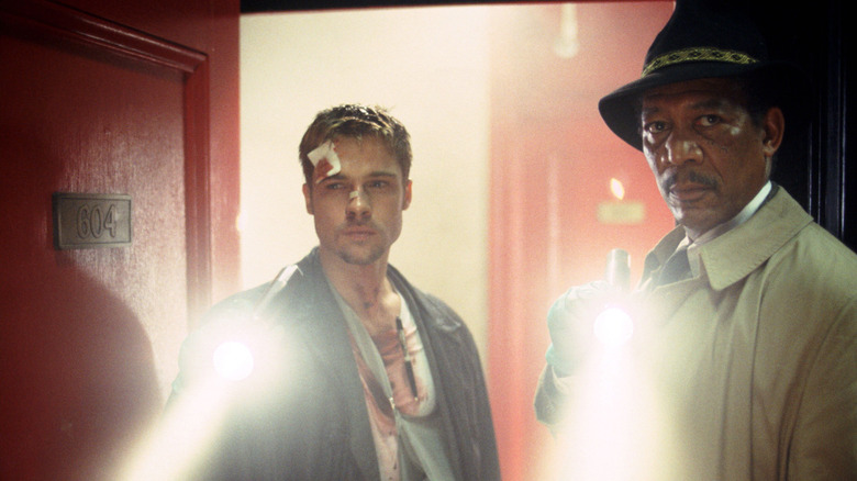 Mills (Brad Pitt) and Somerset (Morgan Freeman) with flashlights in Se7en