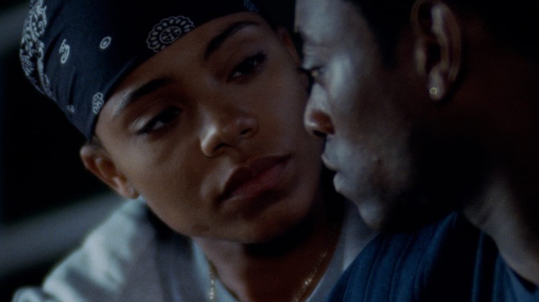 Sanaa Lathan as Monica Wright and Omar Epps as Quincy McCall talking in Love & Basketball