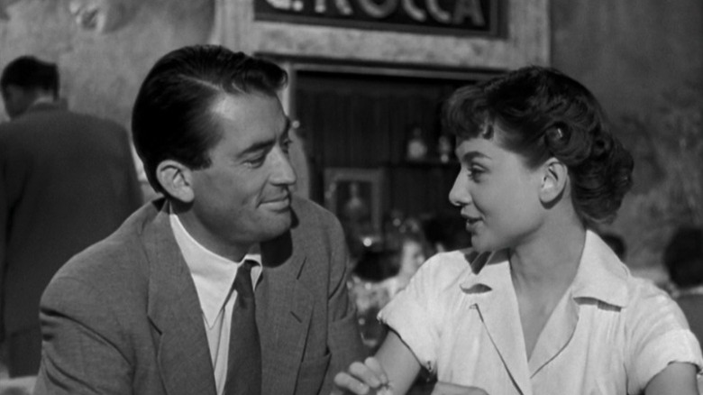 Gregory Peck as Joe Bradley and Audrey Hepburn as Princess Ann talking in Roman Holiday