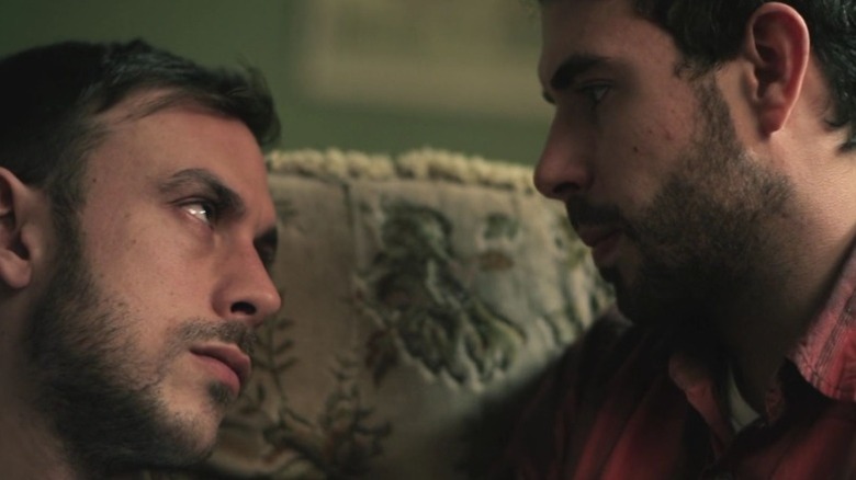 Chris New as Glen and Tom Cullen as Russell look at each other in Weekend