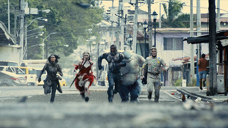 Part of the Suicide Squad running away in the street
