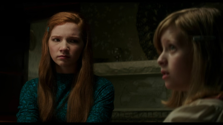 Red-haired girl looking suspiciously at Doris in Ouija: Origin of Evil