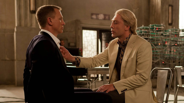 Raoul Silva looking at James Bond's gunshot wound in Skyfall