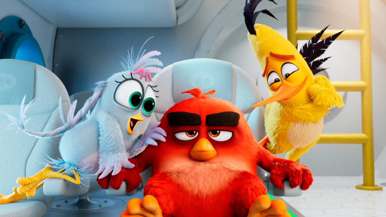 Red looking annoyed by other birds in The Angry Birds Movie 2