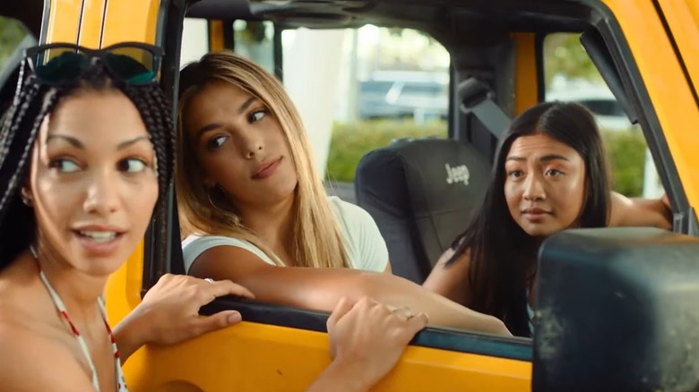 Corinne Foxx as Sasha, Sistine Stallone as Nicole, and Brianne Tju as Alexa, in a yellow jeep, in 47 Meters Down: Uncaged