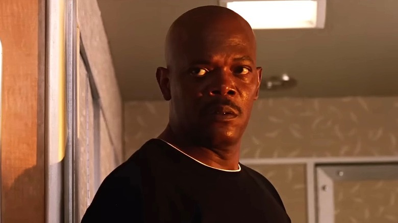 Samuel L. Jackson as Agent Neville Flynn staring at the plane's passengers in "Snakes on a Plane"