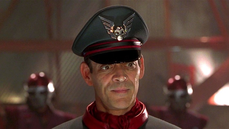 Raul Julia as M. Bison looking down in "Street Fighter"