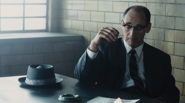 Rudolf Abel sitting at table in prison