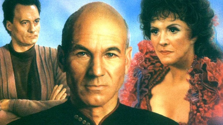 Picard stands between Q and Lwaxana Troi