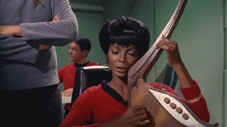 Uhura singing and playing a Vulcan lyre