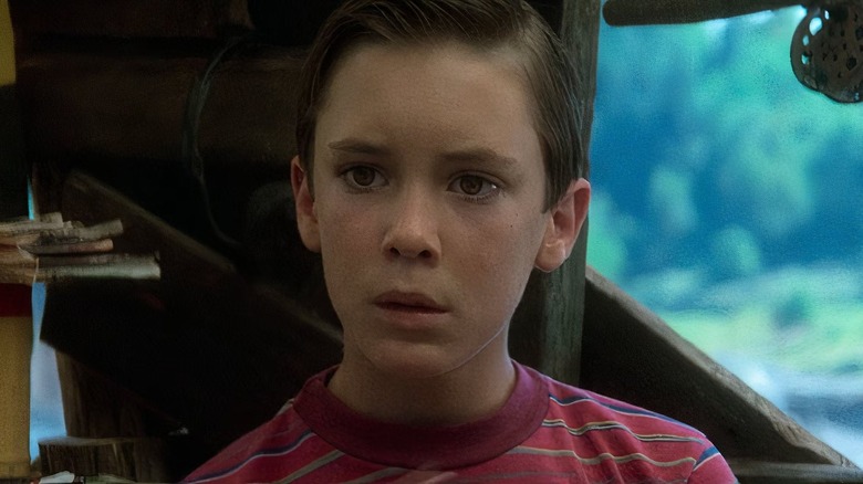 Gordie LaChance (Wil Wheaton) looks downcast in his friends' treehouse in Stand By Me