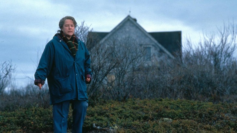 Dolores (Kathy Bates) explores rugged land in Dolores Claiborne