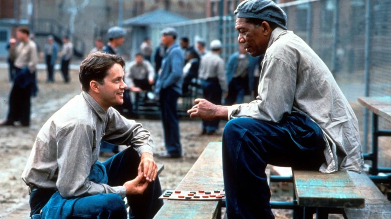 Andy (Tim Robbins) and Red (Morgan Freeman) play Checkers in the prison yard in Shawshank Redemption