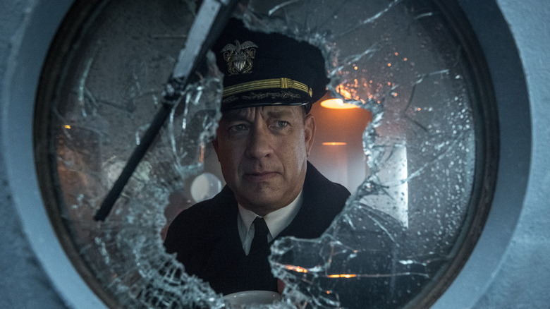 Tom Hanks looks out porthole