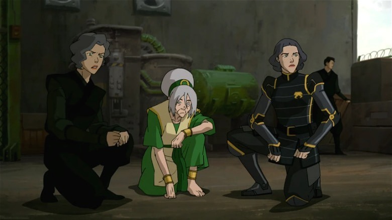 Suyin, Toph, and Lin sitting next to each other