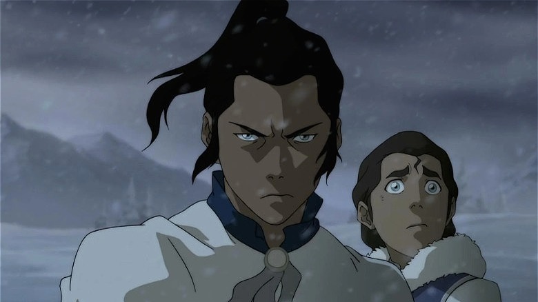 Young Tarrlok standing behind a stern Noatak