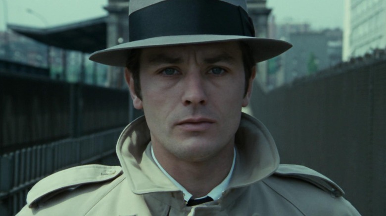 Alain Delon as Jef Costello facing down the camera with furrowed brows in Le Samouraï