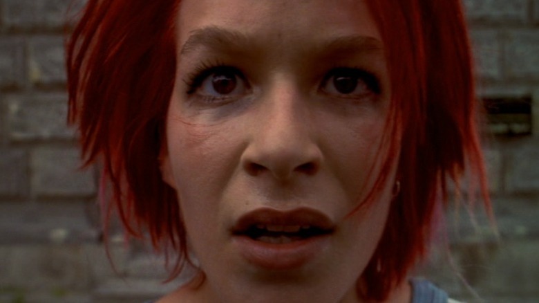 Extreme close-up of Franka Potente as Lola with a concerned expression in Run Lola Run