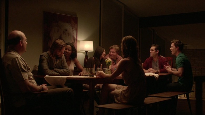 Guests gathered around the dining table in The Invitation