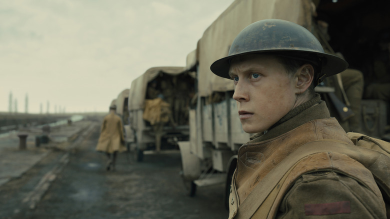 George MacKay as Will Schofield looks out from a convoy in 1917