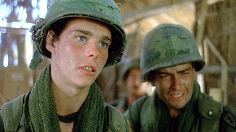 Kevin Dillon as Bunny and Charlie Sheen as Chris Taylor staring incredulously in Platoon