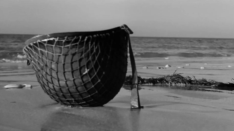 An American Army helmet rests on the beach in The Longest Day