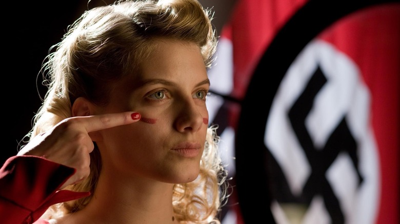 Shoshanna (Melanie Laurent) putting on makeup in Inglourious Basterds