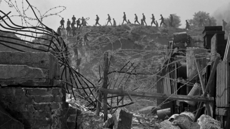 Soldiers marching into ruins of Warsaw in Kanal