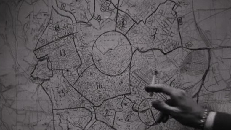 German officer pointing at map of Rome in Rome, Open City