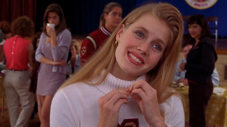 Amy Adams smiling in a cheerleader uniform