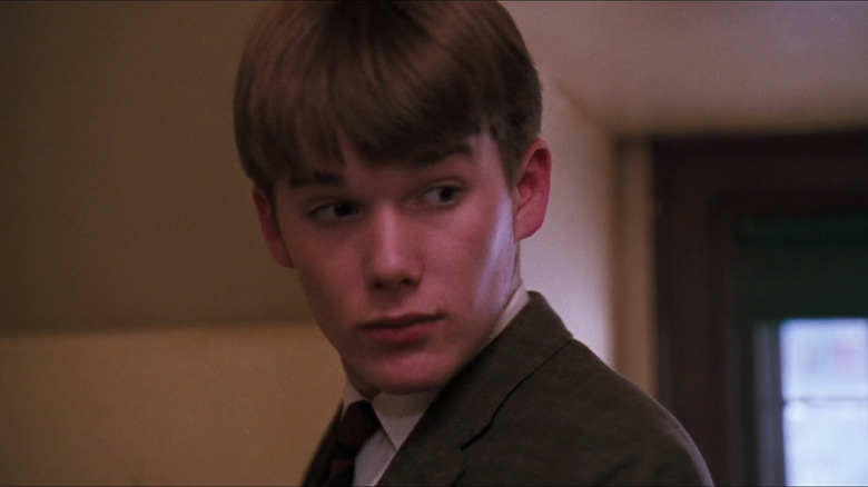 Young Ethan Hawke looking over shoulder