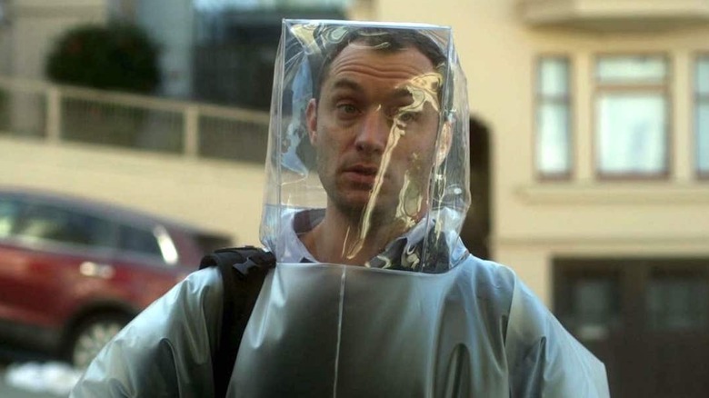 Jude Law wearing a protective suit