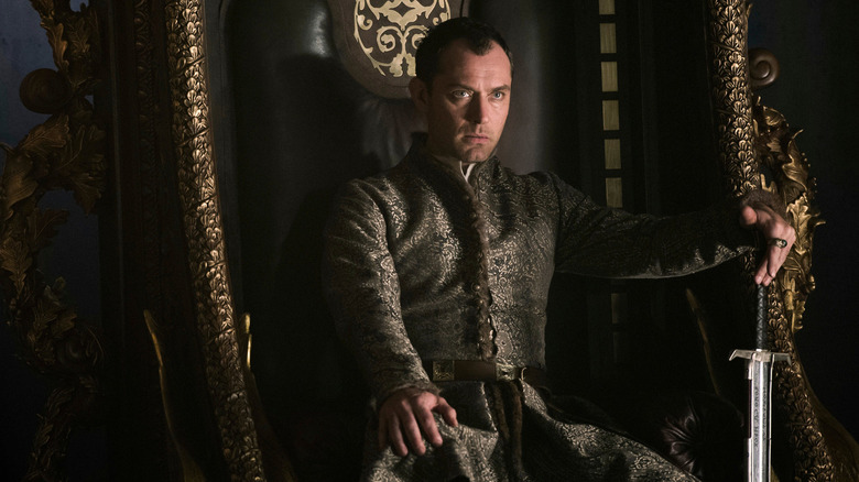 Jude Law sitting on throne